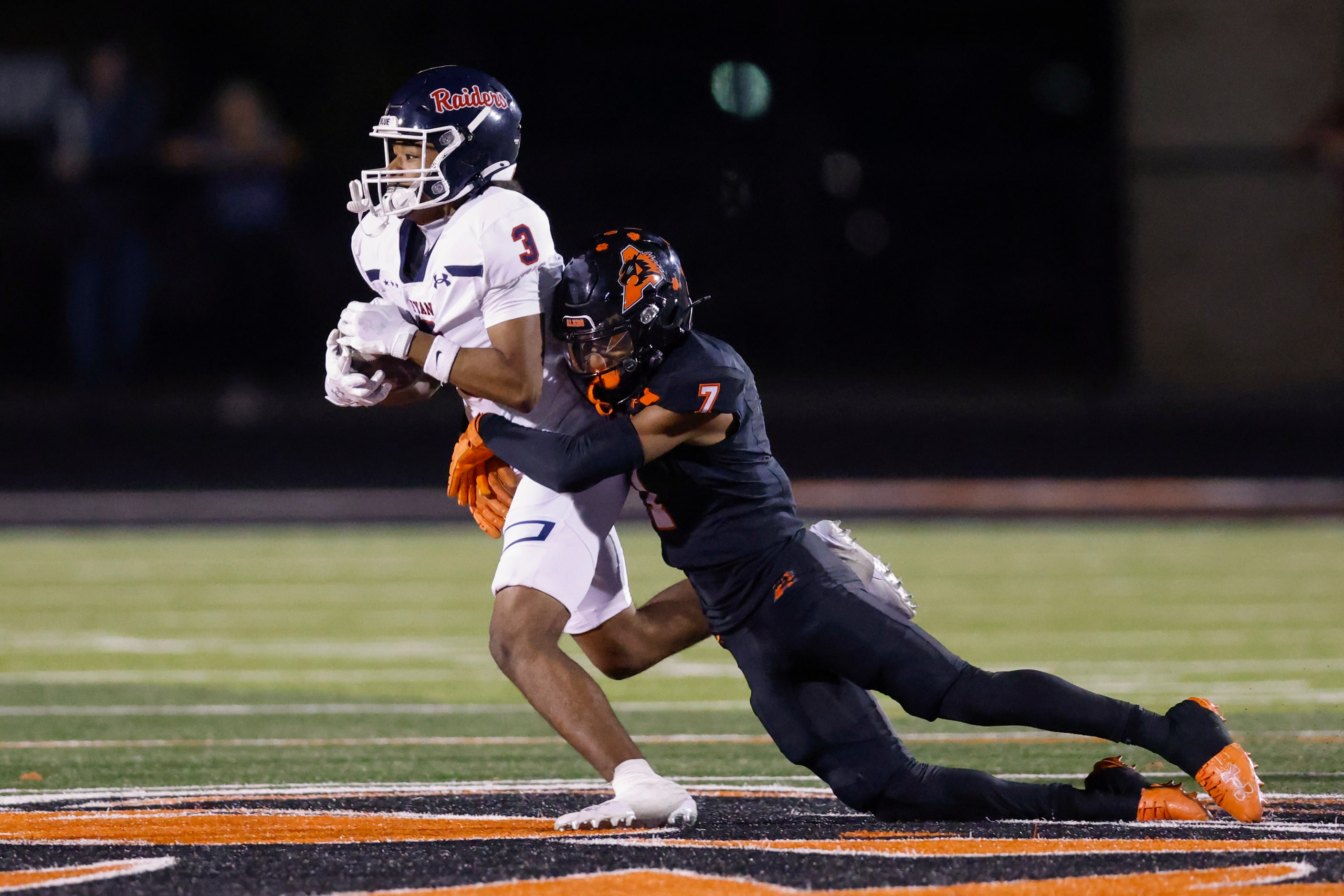 Aledo defensive back Adrian Fuller (7) tackles Denton Ryan wide receiver Lorenzo Hill (3)...