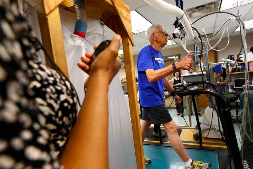 Richard Rahn gives the thumbs-up during a treadmill stress test at the Institute for...