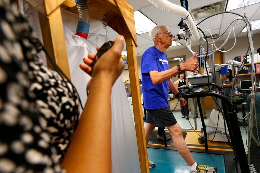 Richard Rahn gives the thumbs-up during a treadmill stress test at the Institute for...