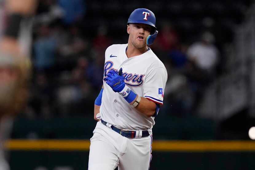 Texas Rangers' Josh Jung runs the bases after hitting a two-run home run during the sixth...
