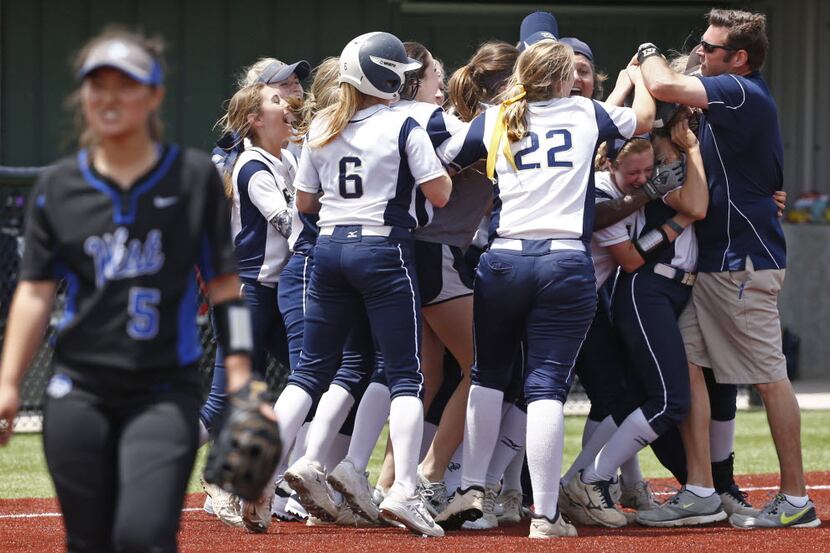 Keller celebrates after Shelby Henderson (5) hit the winning run against Plano West at the...