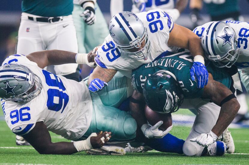 Philadelphia Eagles running back Corey Clement (30) is tackled by Dallas Cowboys defensive...