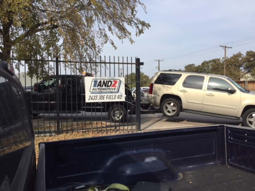 A car is towed into 1and2 Automotive, a common sight at the "Buy here, pay here" auto dealer...