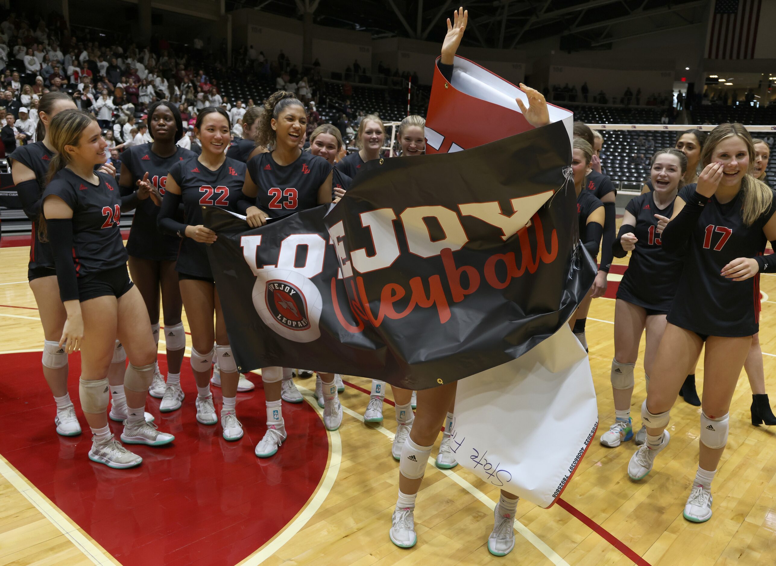 Lucas Lovejoy players get wrapped up in celebrating after their straight sets victory over...