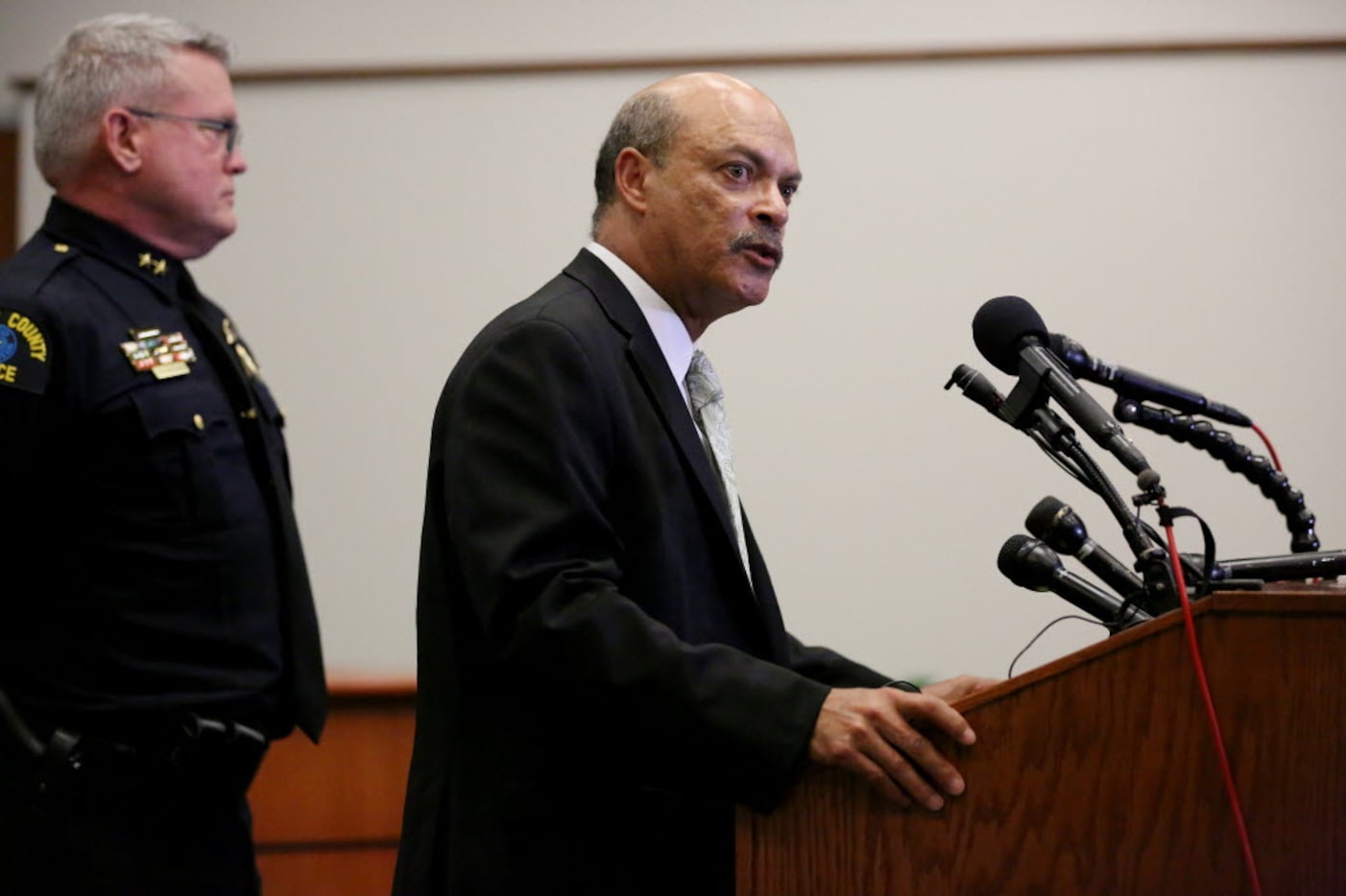 Dr. Jose Adames (right), president of El Centro College, and El Centro police chief Joseph...