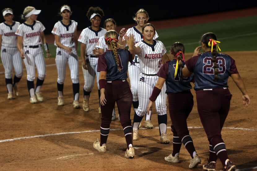 Aubrey players, left, shake hands with Corpus Christi Calallen players after losing 5-1. The...