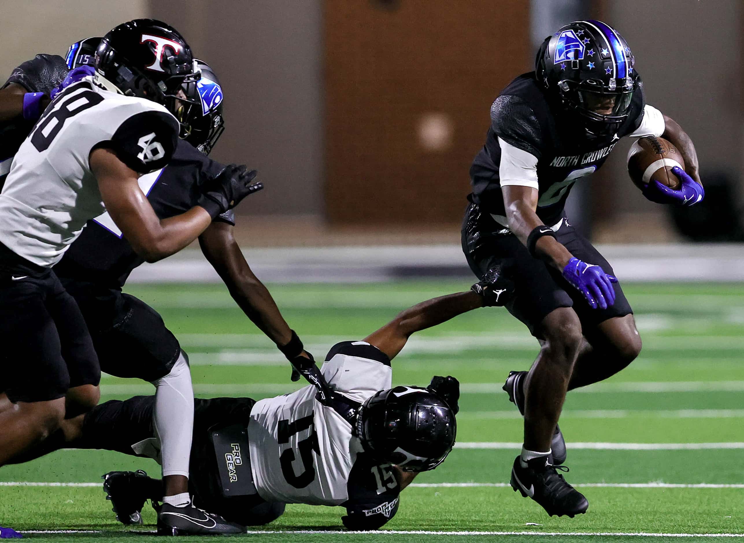 North Crowley running back Ashton Searl (8) breaks free from Euless Trinity defensive back...