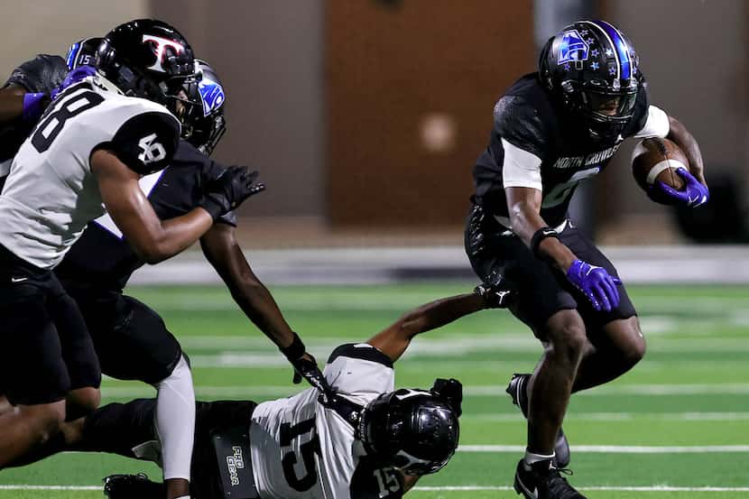 North Crowley running back Ashton Searl (8) breaks free from Euless Trinity defensive back...