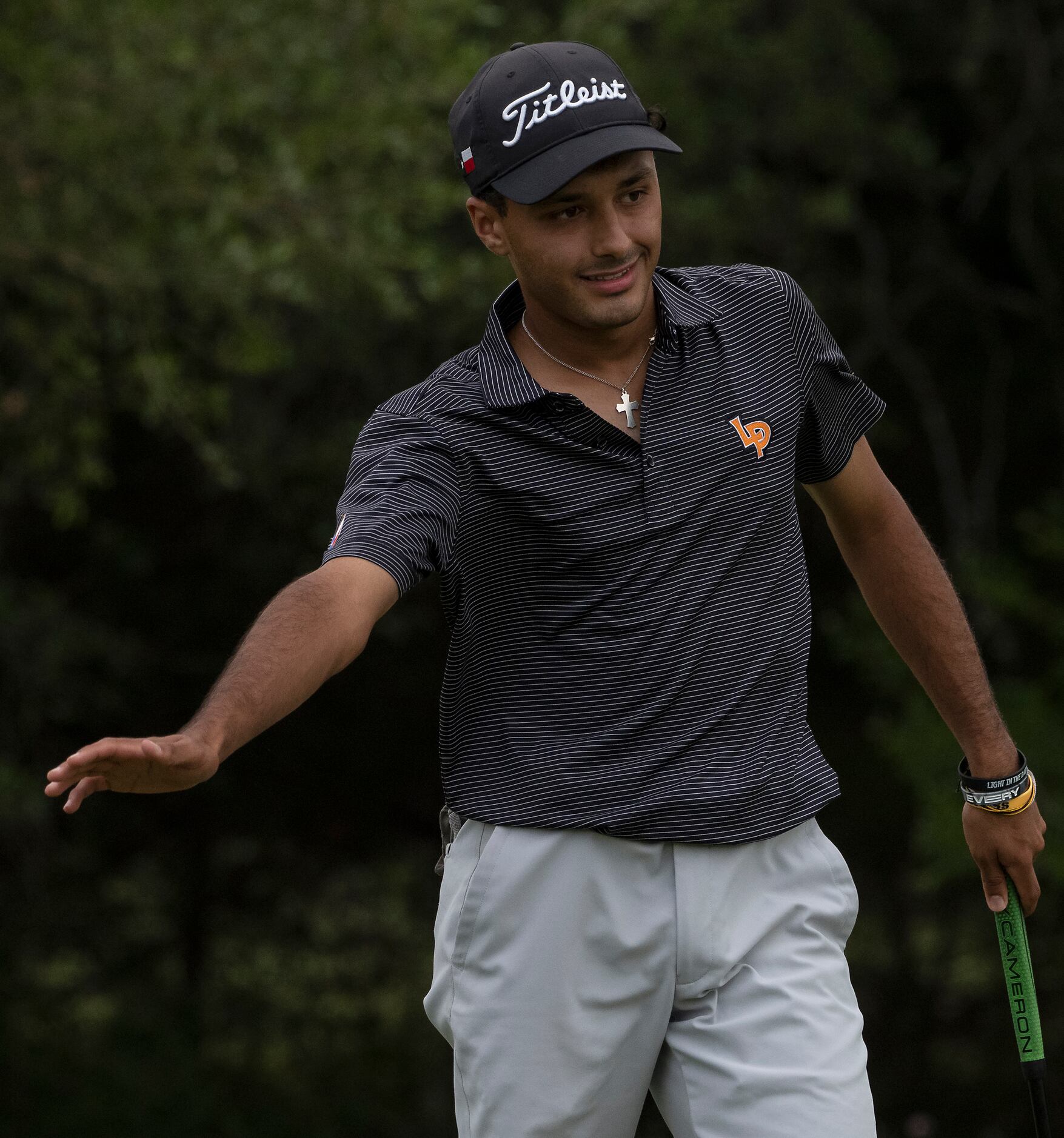 La Porte Nicholas Canales, talks to his ball on the no.1 green during the final round of UIL...