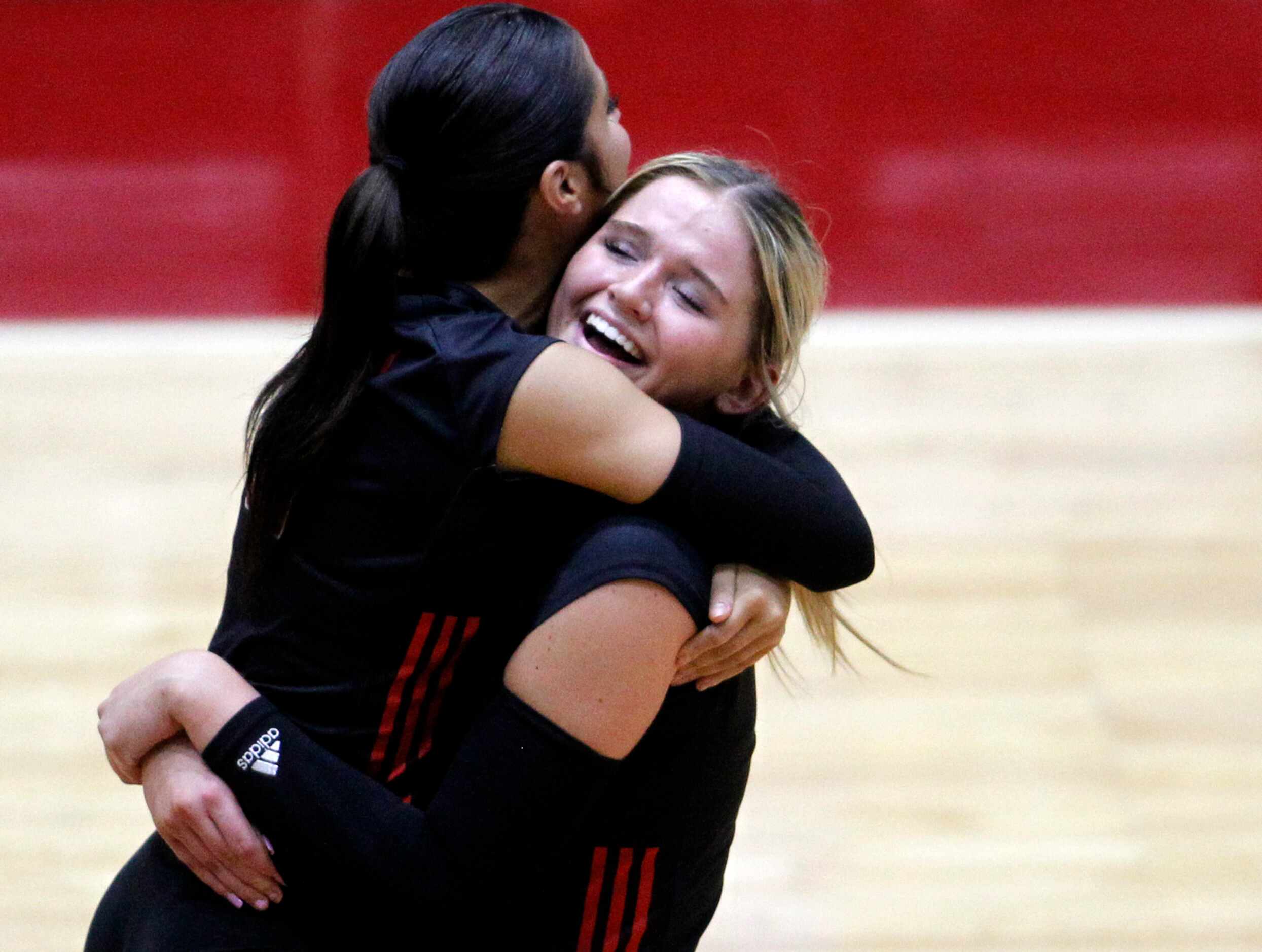 Lucas Lovejoy sophomore Skylar Jackson (10), right, was all smiles as she shares a hug with...