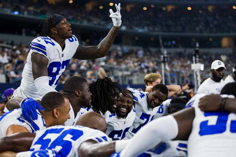 Dallas Cowboys defensive end Taco Charlton (97) and other players get hyped by before an NFL...