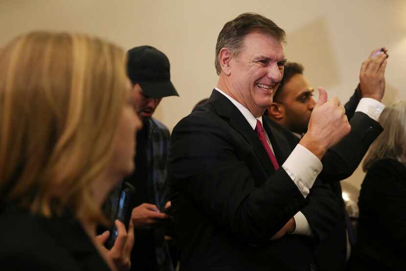 Dallas mayor Mike Rawlings reacts during an election night party for Democratic candidate...