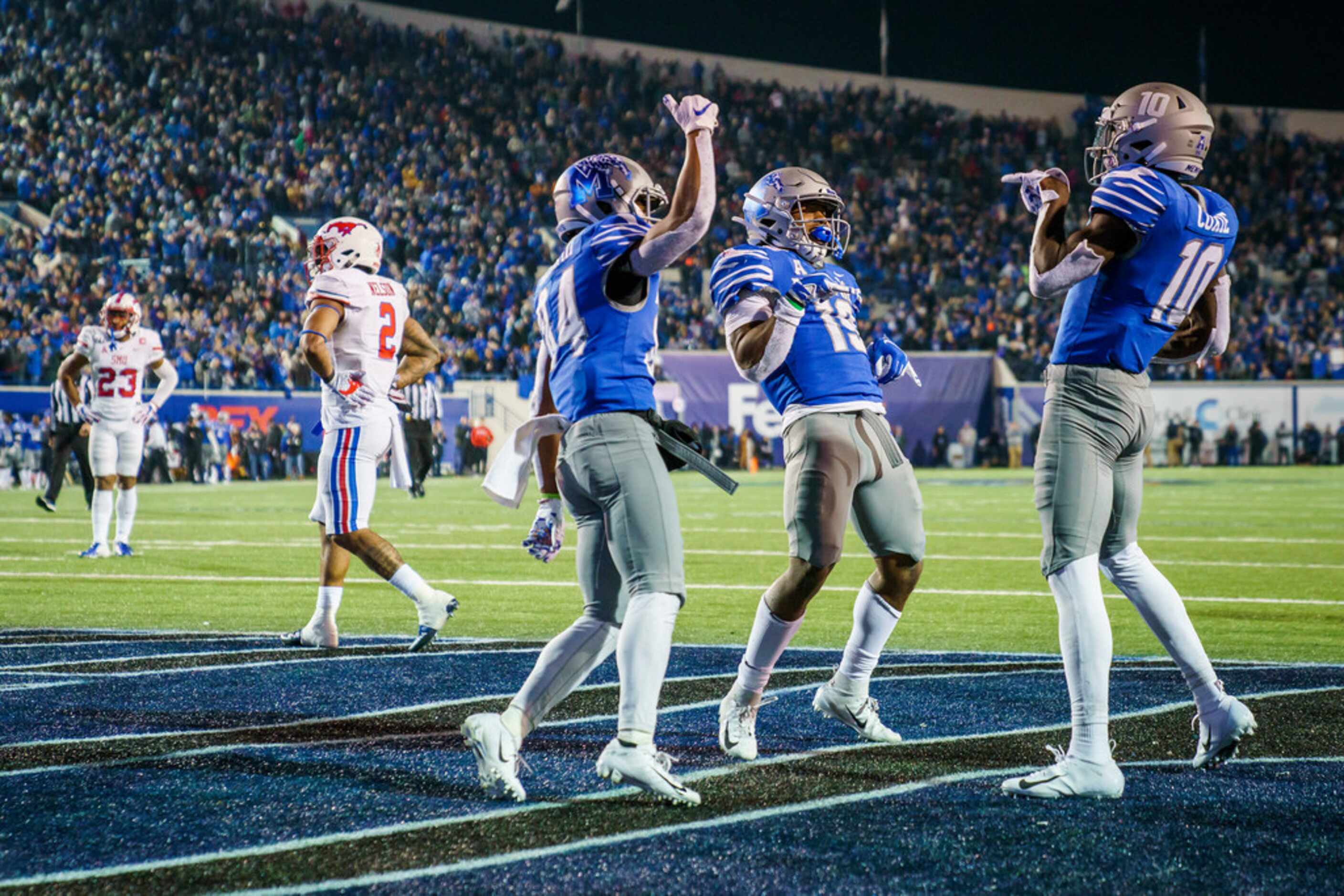 Memphis wide receiver Damonte Coxie (10) celebrates with wide receiver Antonio Gibson (14)...