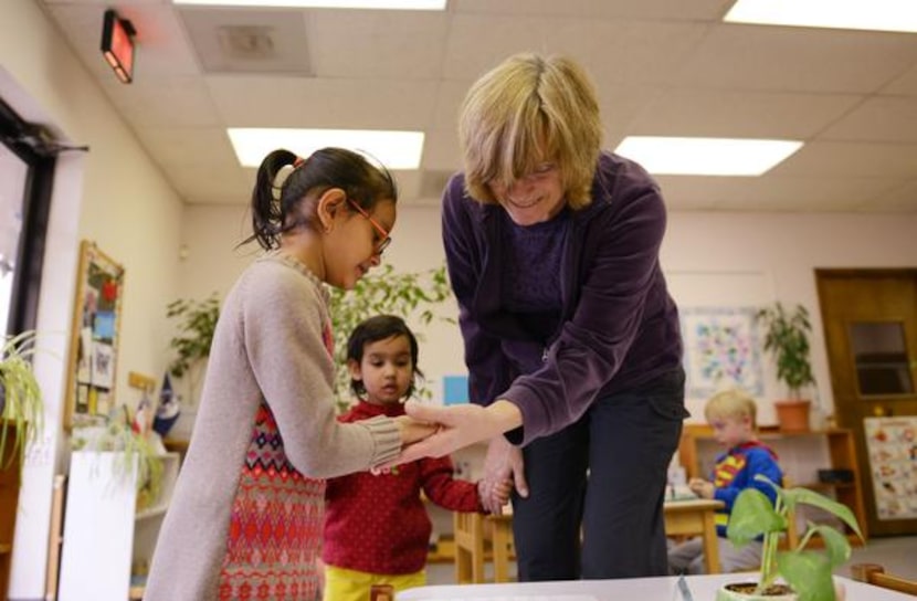 
Co-owners Heather Mazin congratulates student Aayushi Dabi afar completing an assignment at...