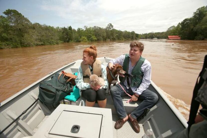 
Hunter and Sarah Anderson and their two dogs were rescued Wednesday by Marine Police from...