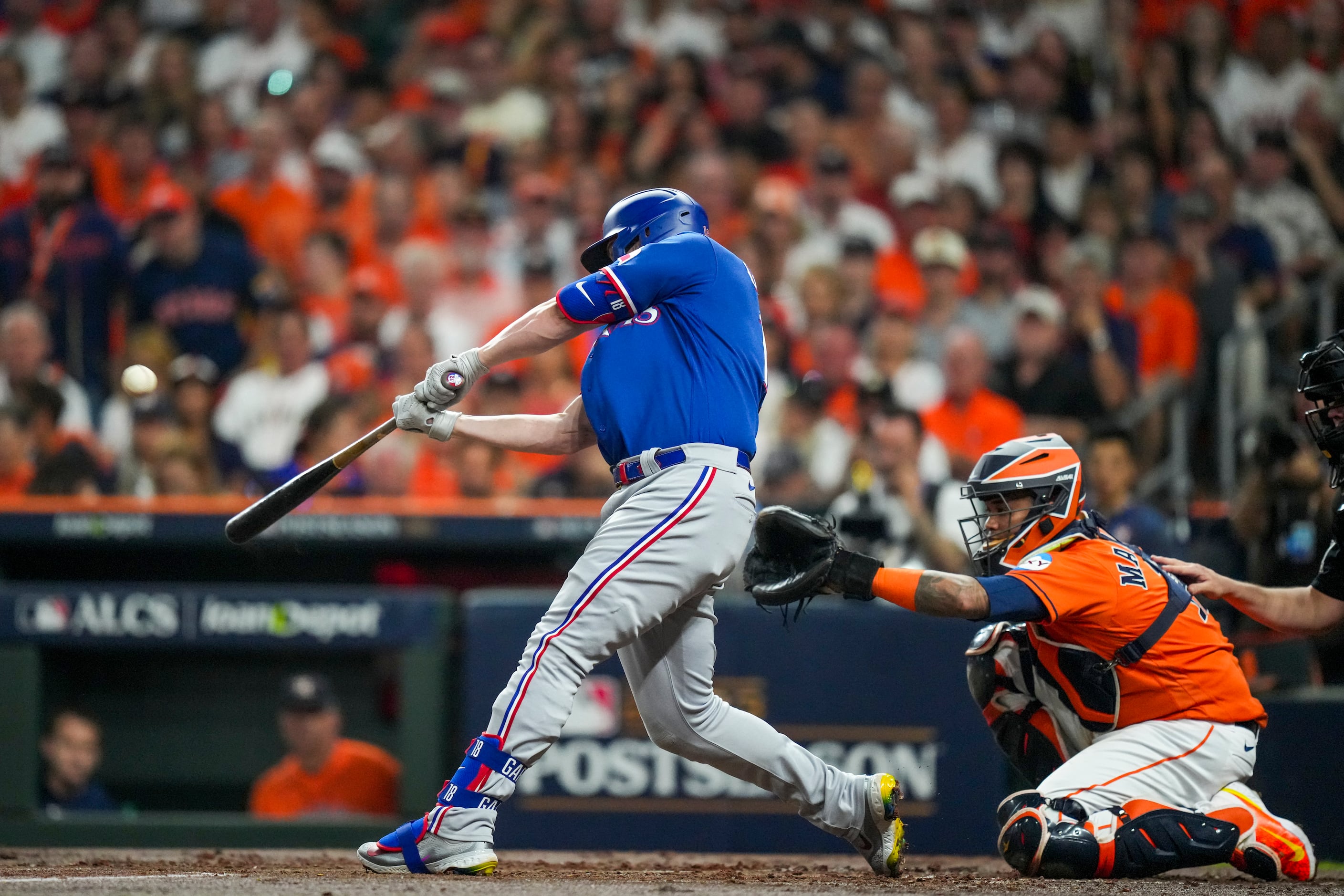 Texas Rangers catcher Mitch Garver (18) poses for a photo with