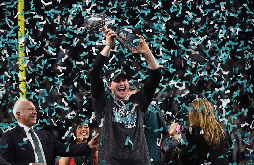 TOPSHOT - Philadelphia Eagles quarterback Carson Wentz celebrates after winning Super Bowl...