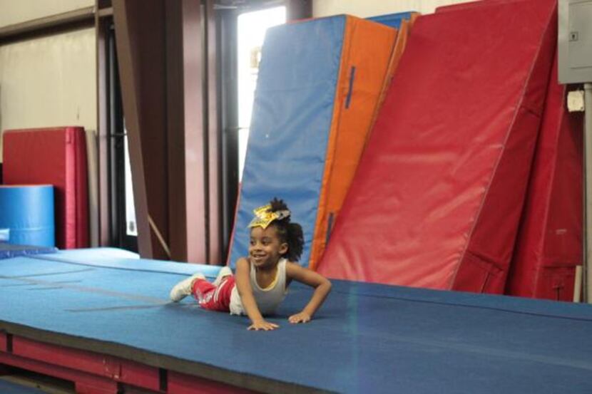 
Mikiyah Tanner smiles after practicing tumbling at Twister Spirit Athletics in Cedar Hill.
