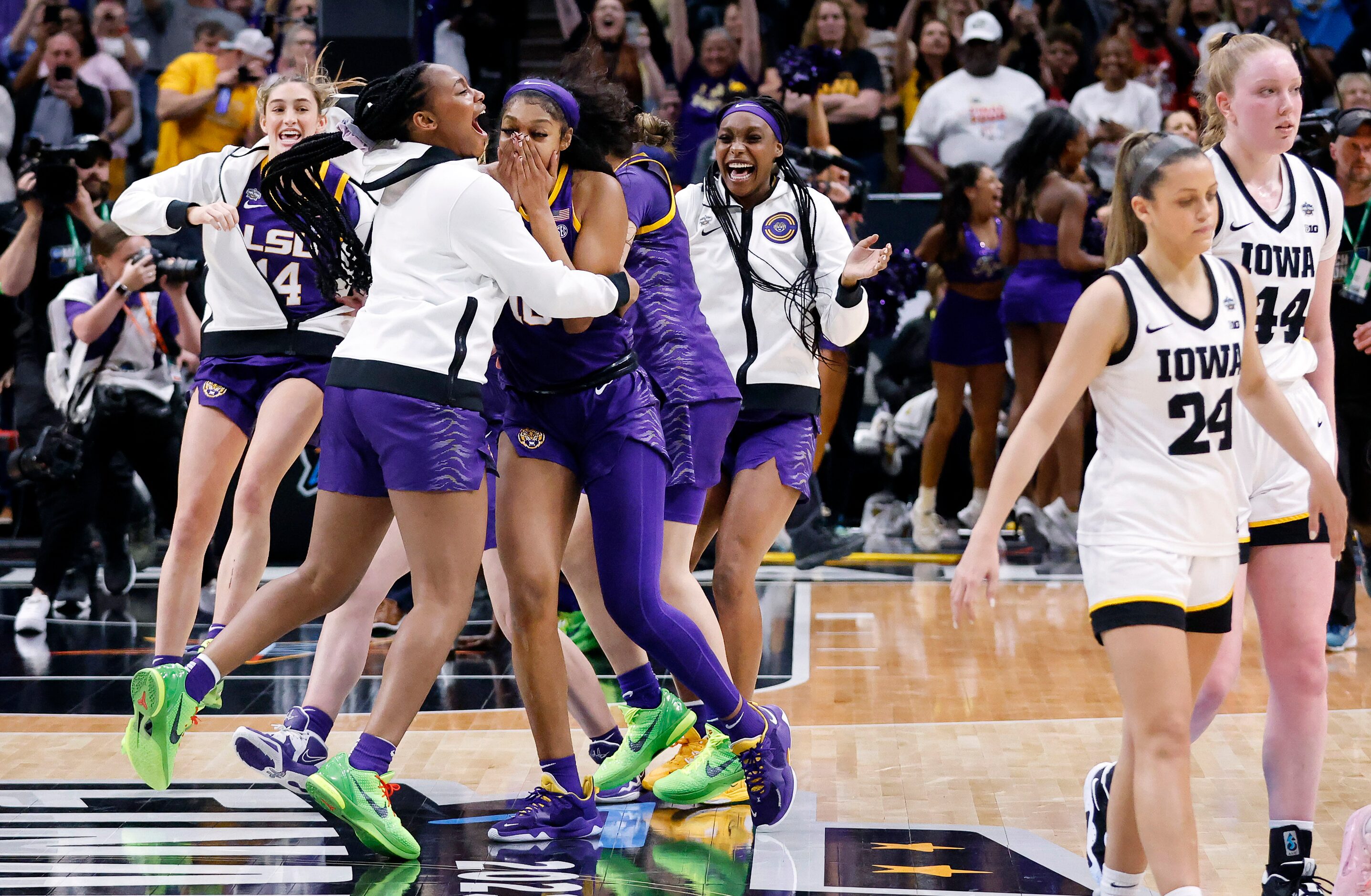 LSU Lady Tigers forward Angel Reese (center, right) and her teammate Alisa Williams (center,...