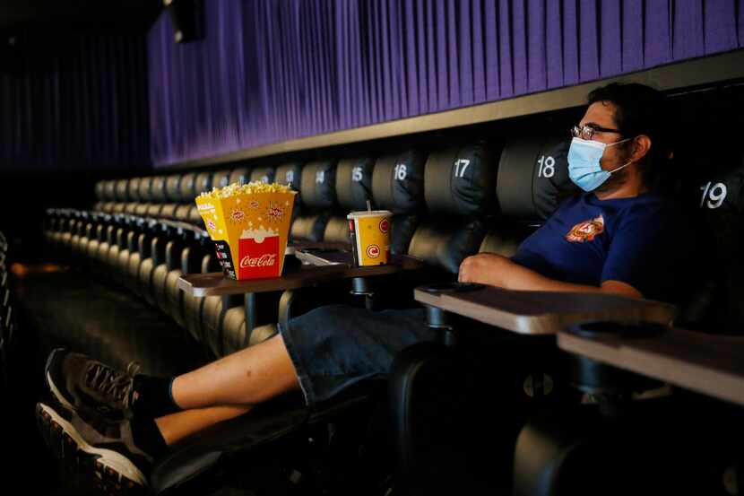 Ben Levy of Plano watches trailers play as he waits for "Sonic the Hedgehog," to start at...