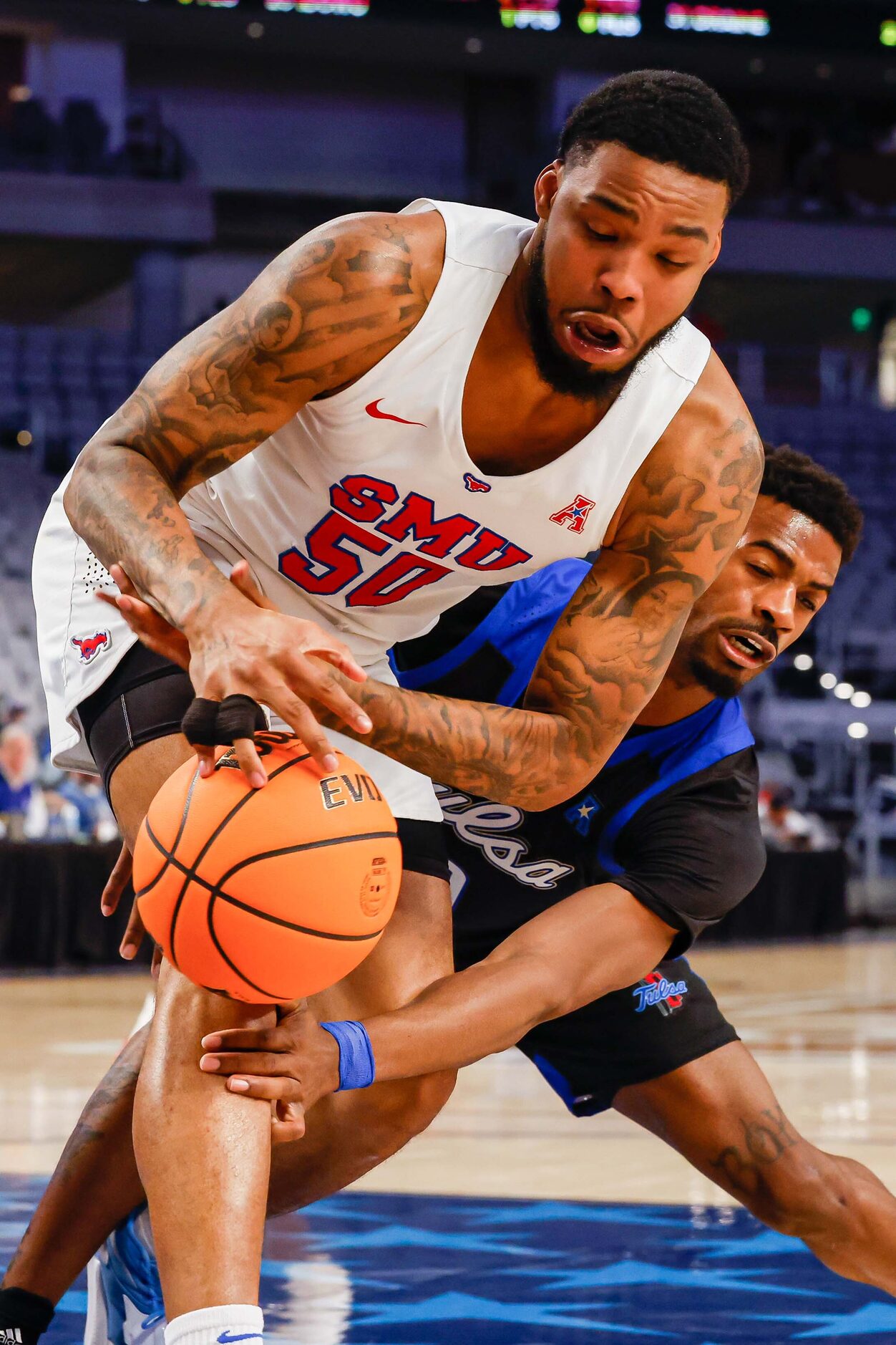 Tulsa Golden Hurricane guard Curtis Haywood II (0) makes a foul holding Southern Methodist...