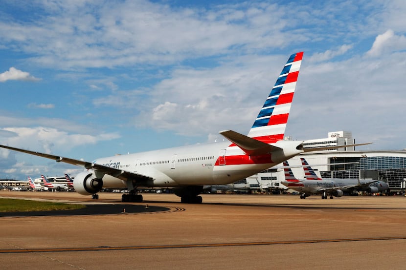 An American Airlines jet taxis at DFW International Airport.