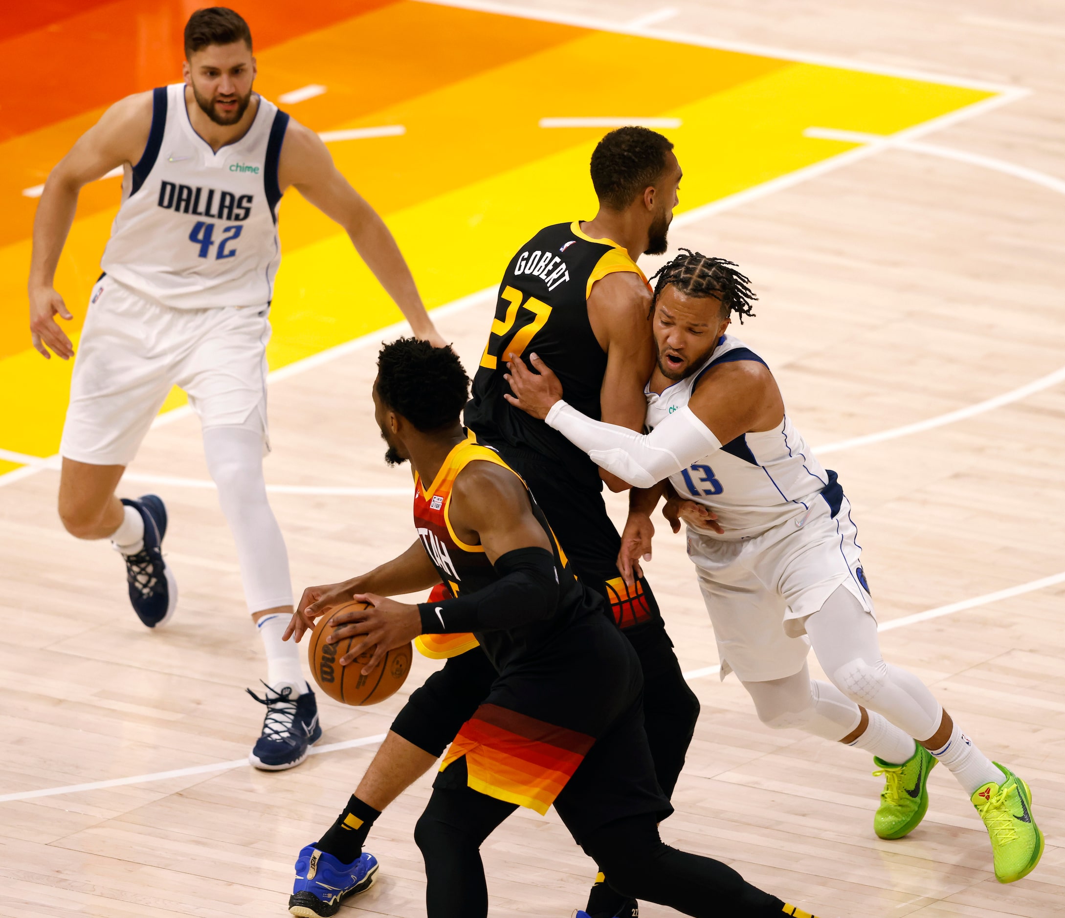 Dallas Mavericks guard Jalen Brunson (13) runs into a screen from Utah Jazz center Rudy...