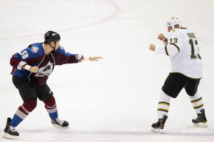 Krys Barch (right) squares off with Colorado's Patrick Bordeleau for a fight in the second...