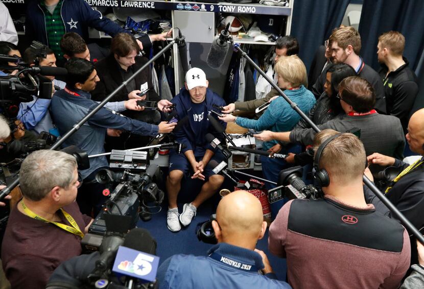 Dallas Cowboys quarterback Tony Romo talks to the news media at Dallas Cowboys headquarters...
