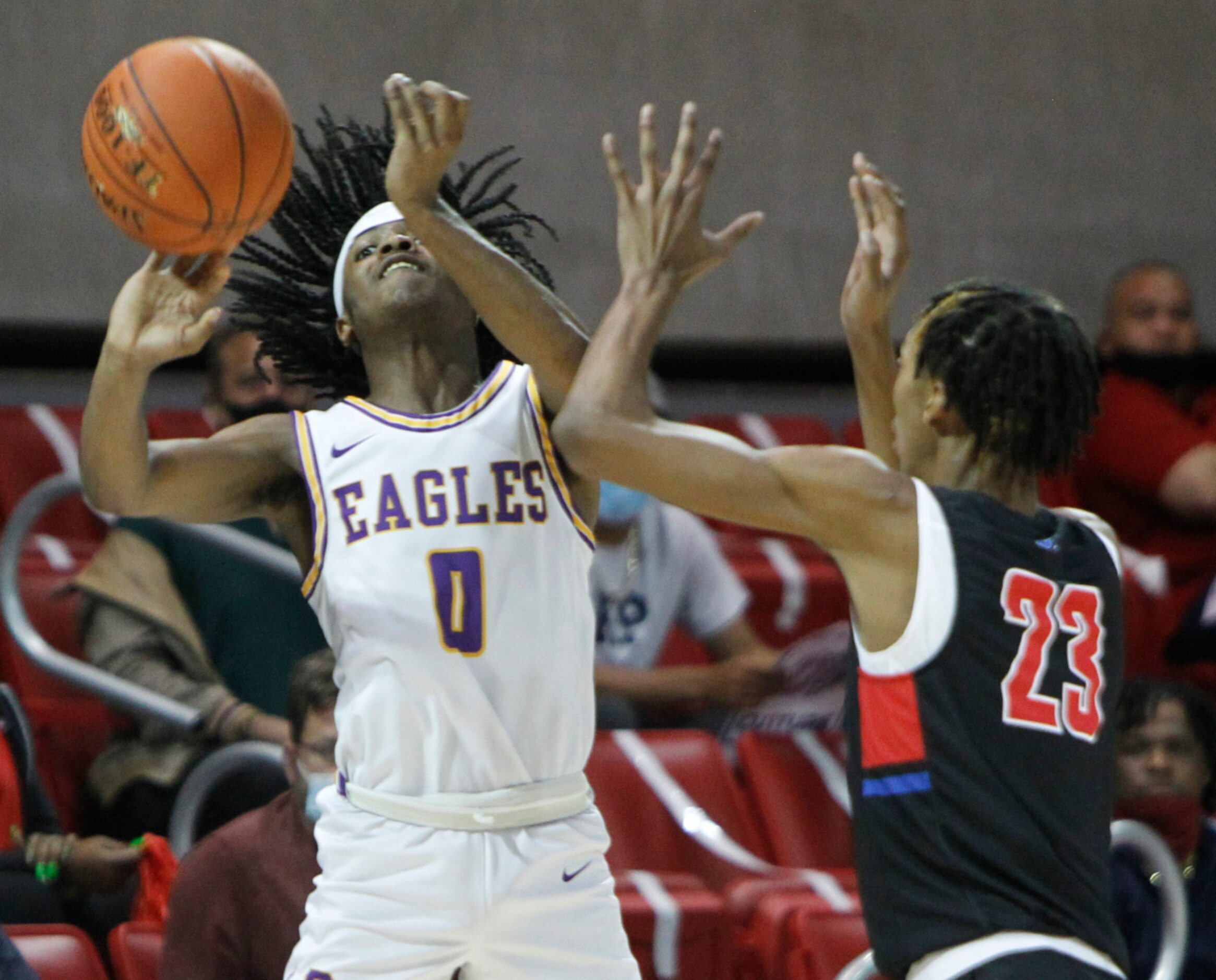 Richardson guard Jaylon Barnett (0) gets off a desperation last second shot as he is...