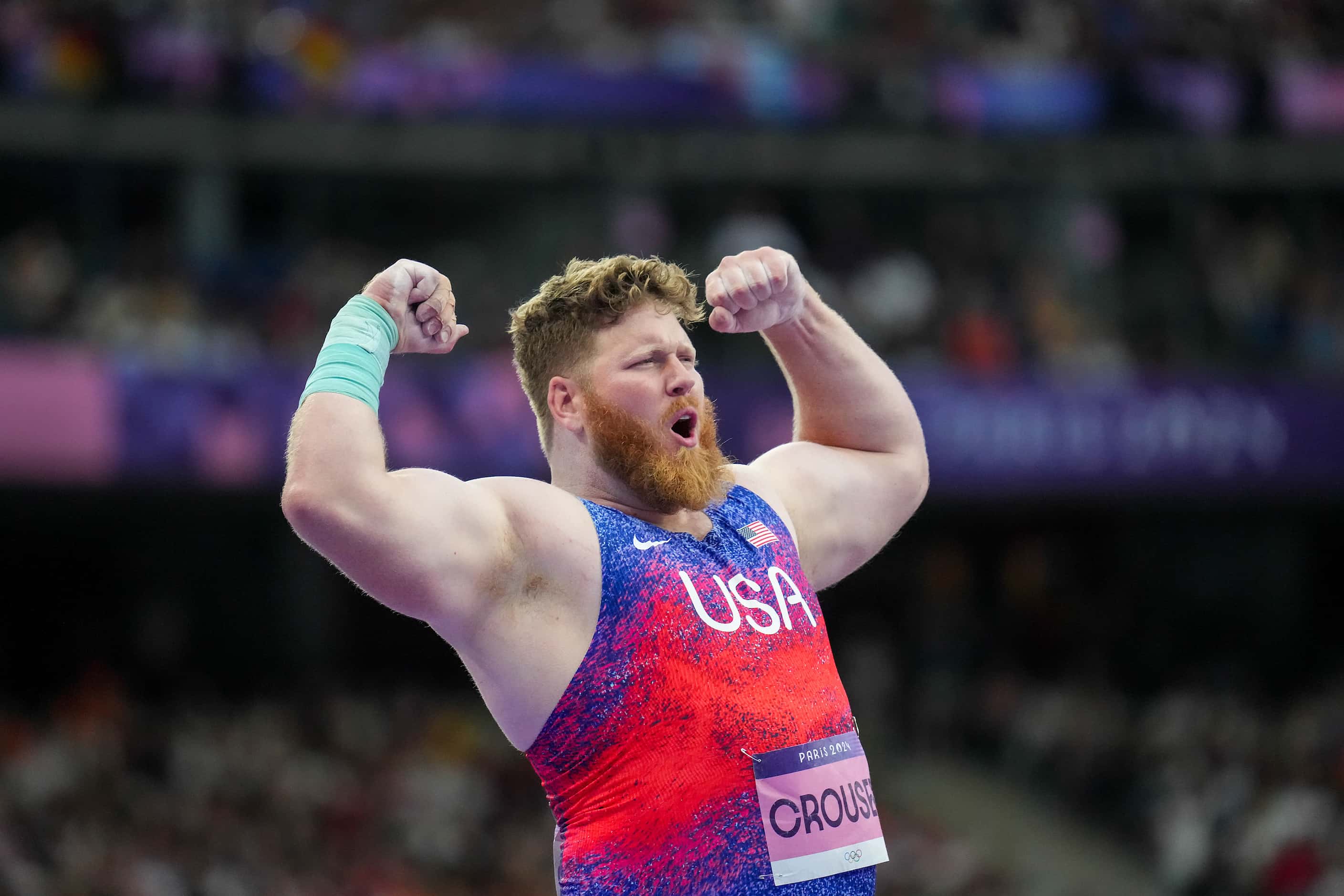 Ryan Crouser of the United States reacts while competing in the men’s shot put final at the...
