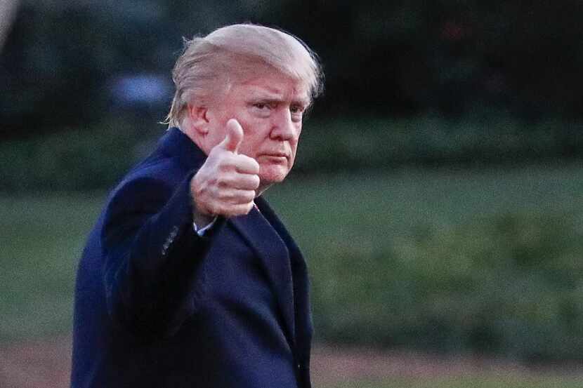 President Donald J. Trump waves as he walks across the South Lawn towards the White House on...
