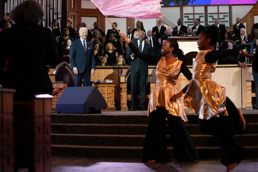 President Joe Biden and Sen. Raphael Warnock, D-Ga., attend a Sunday service honoring Martin...