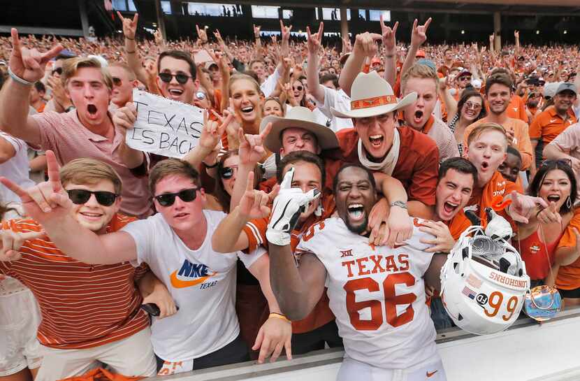 Texas Longhorns offensive lineman Calvin Anderson (66) celebrates with fans after the...