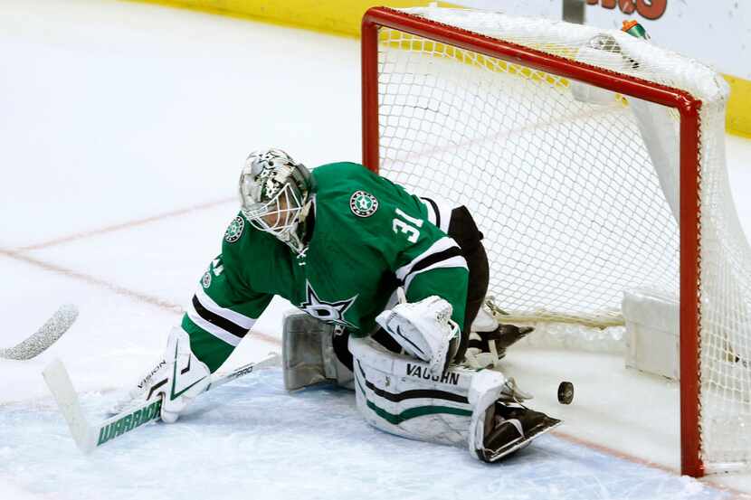 The puck slips by Dallas Stars goalie Antti Niemi and into the goal on a shot from Nashville...