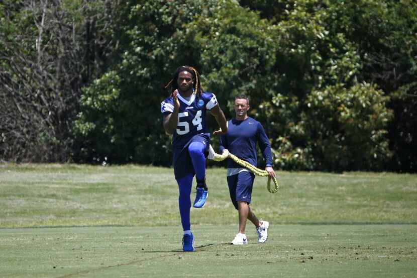 FILE - Dallas Cowboys Jaylon Smith works out during OTA practice at Valley Ranch in Irving,...