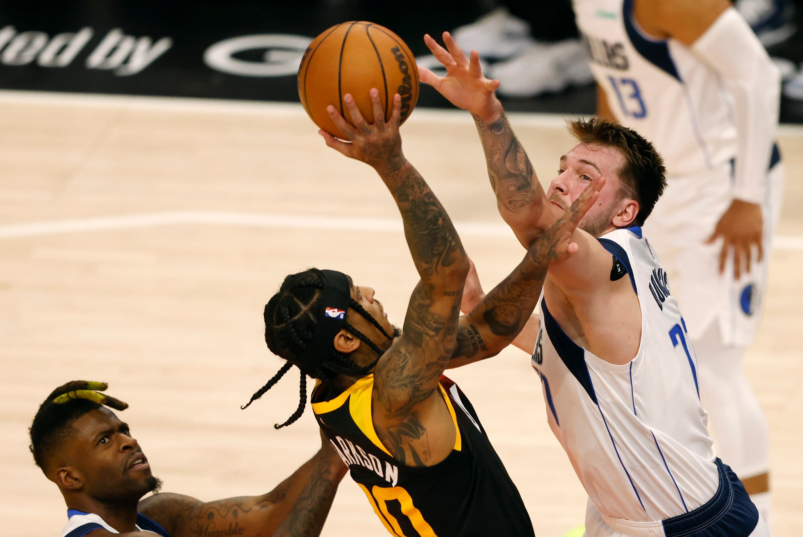 Dallas Mavericks guard Luka Doncic (77) defends as Utah Jazz guard Jordan Clarkson (00)...