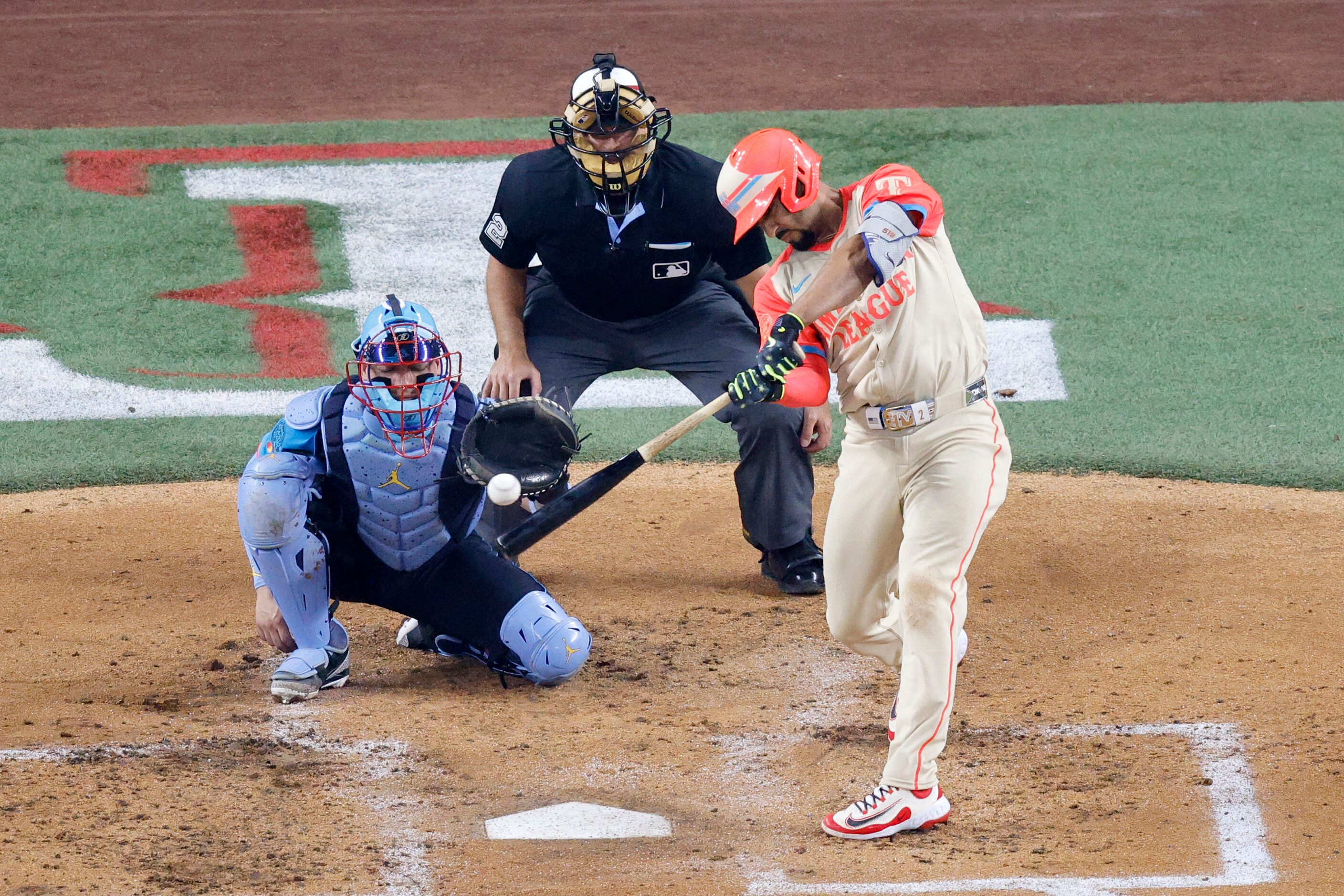 American League second base Marcus Semien of Texas Rangers (2) hits a single during the...