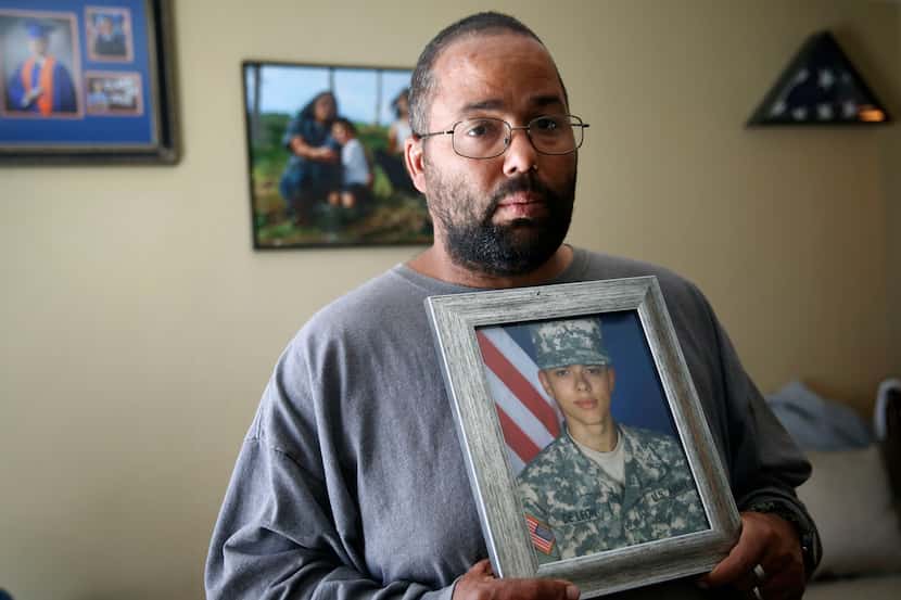 Ricky DeLeon holds a portrait of his son, Isaac Lee DeLeon, at his home in San Angelo on...
