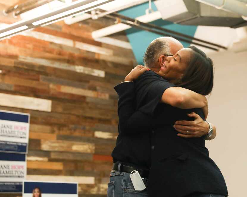 Jane Hamilton, runoff candidate for District 30, receives a hug from her father, Gregory...