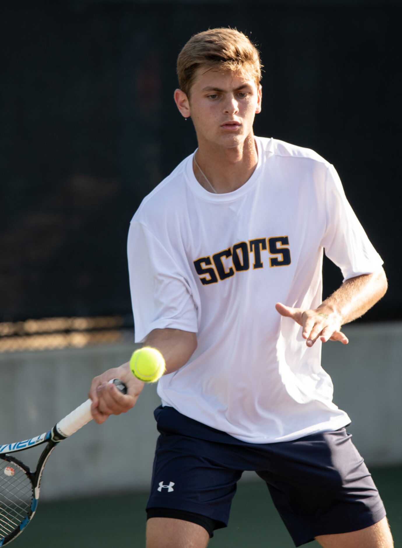 Highland Park's Peyton Dooley returns the ball in a singles match against Boerne Champion's...