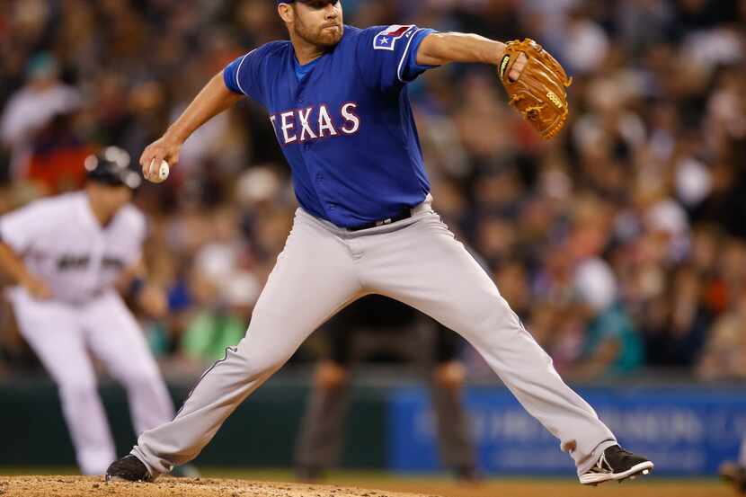 SEATTLE, WA - APRIL 26:  Starting pitcher Colby Lewis #48 of the Texas Rangers pitches in...