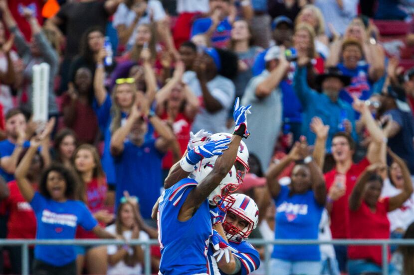 Southern Methodist Mustangs celebrate a touchdown by Southern Methodist Mustangs wide...