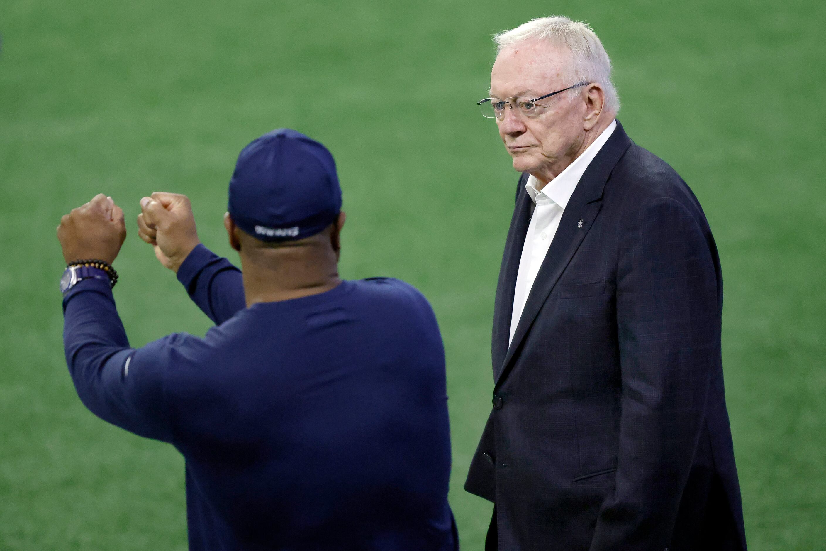 Dallas Cowboys owner Jerry Jones (right) listens to Vice President of Player Personal Will...