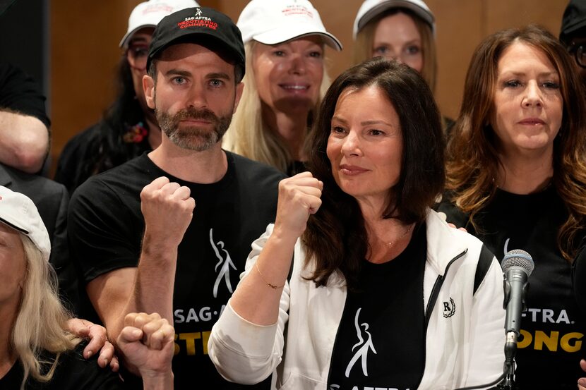 SAG-AFTRA president Fran Drescher, center, Ben Whitehair, left, and Joely Fisher attend a...