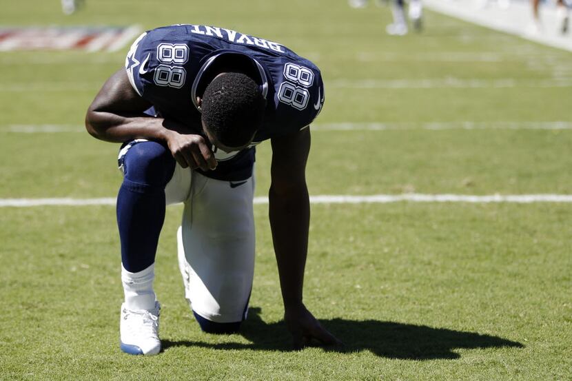 Dallas Cowboys wide receiver Dez Bryant (88) takes a moment in the end zone before playing...