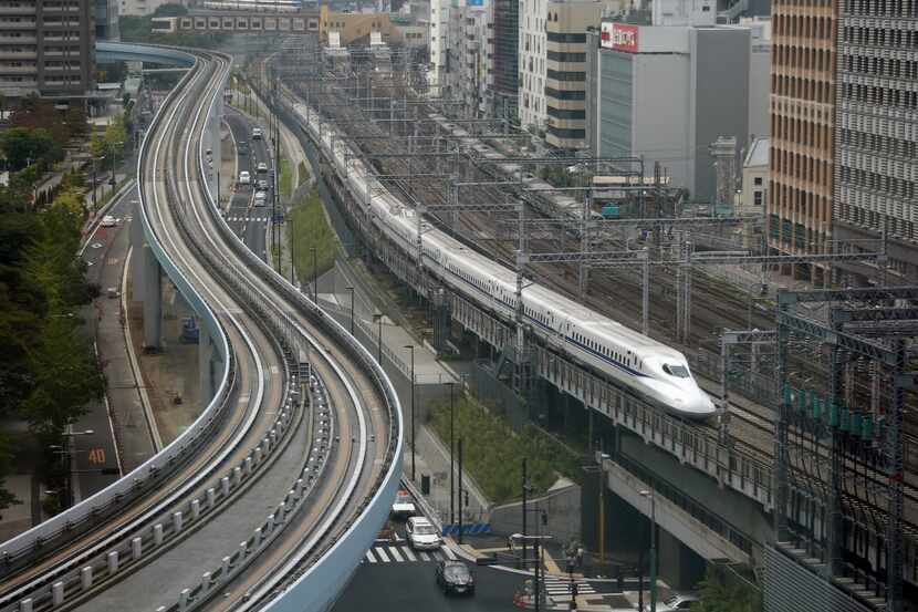 A Shinkansen bullet train heads for Tokyo Station on the Tokaido Main Line. The Shinkansen...