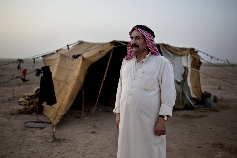 Ahmed Abdullah, a 48-year-old farmer who is living in a burlap and plastic tent with his...