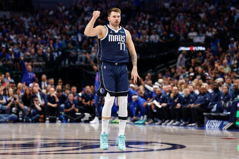 Dallas Mavericks guard Luka Doncic (77) celebrates after a three-point shot during the first...