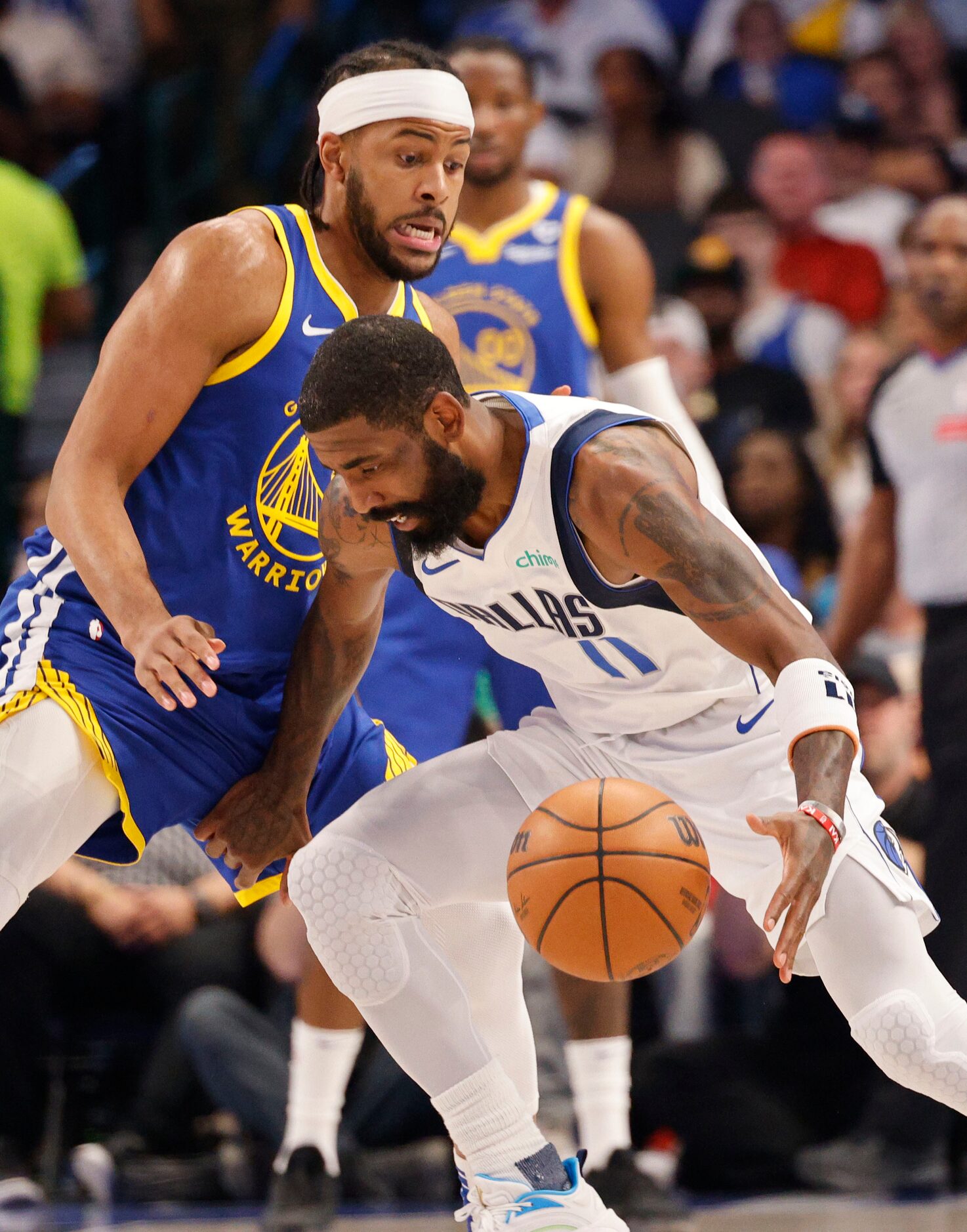 Dallas Mavericks guard Kyrie Irving (11) tries to drive past Golden State Warriors guard...